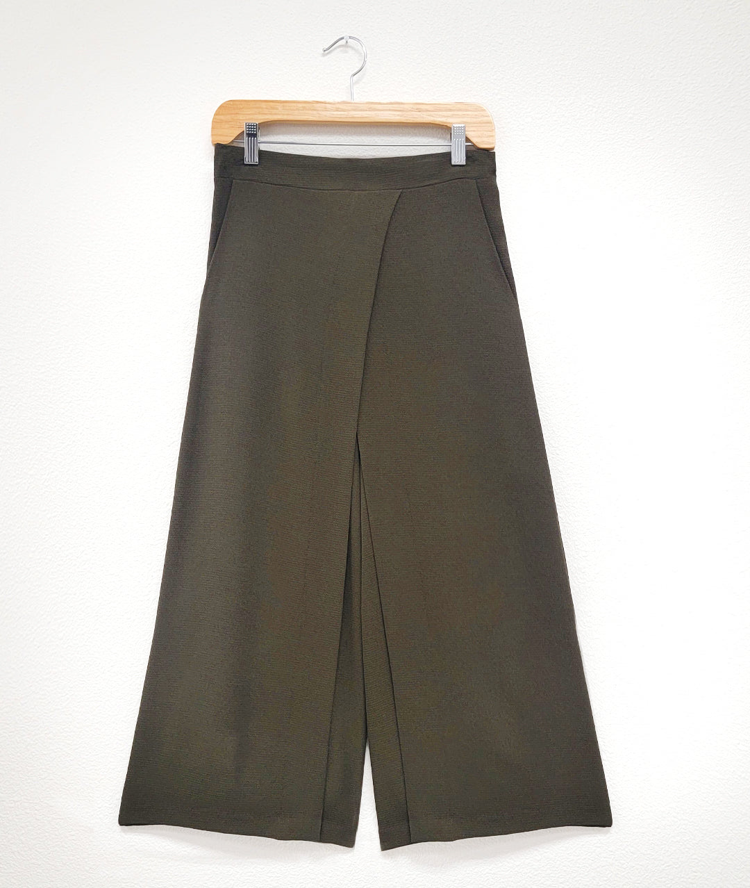 olive green pant with A-line shape and crossover apron front. Flat band front, elastic back waist. Pockets in side seams