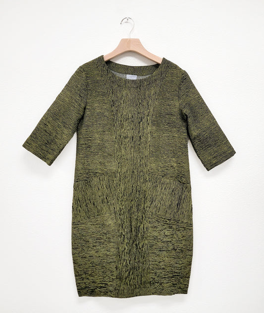 green and black short sleeve shift dress with princess seams and a contrasting center panel