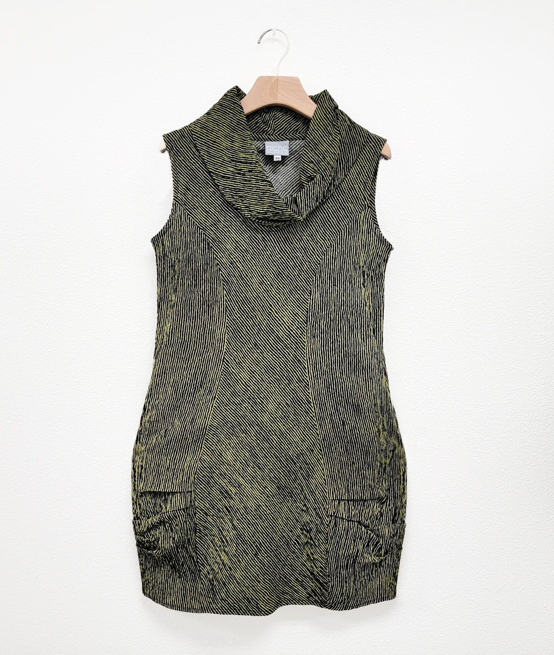 green and black striped sleeveless tunic with a large cowl neckine, princess seams, and shaping pleats around the hips