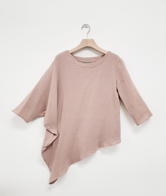 asymmetrical taupe color gauze top with one cocoon sleeve and a dipped hem