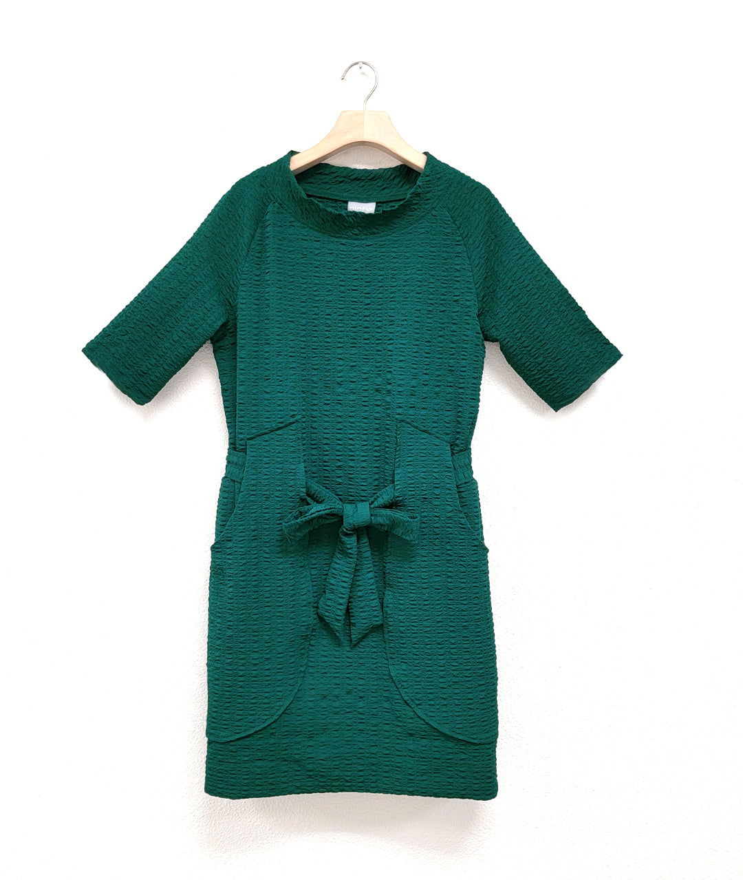 emerald green color raglan sleeve shift dress with a matching tie belt at the waist, which runs through exterior pocket loops