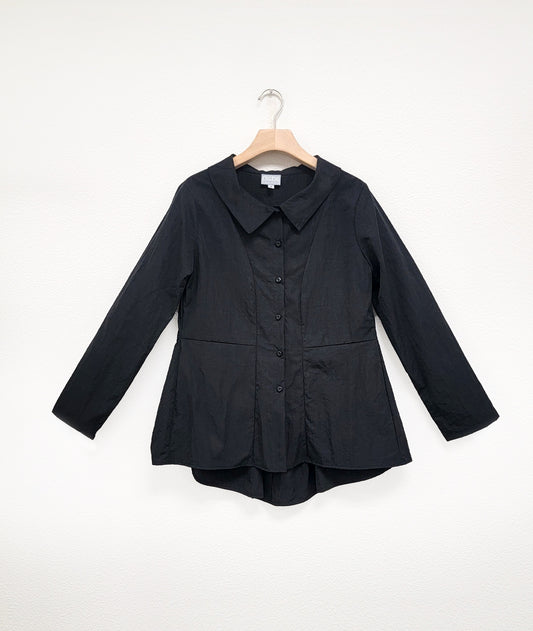 black button down jacket with long sleeves, a seam at the natural waist, and a peplum in the back with a gathered detail at the waist, with a small collar