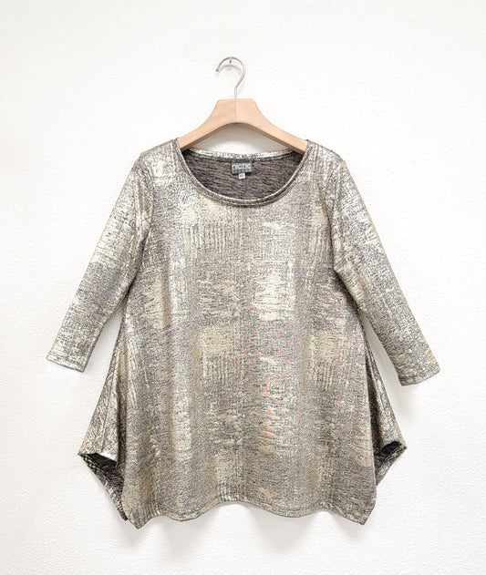 gold metallic multi texture pullover top with a round neckline, 3/4 sleeves, and a wide hem with splits on either side, giving the illusion of a dipped hem