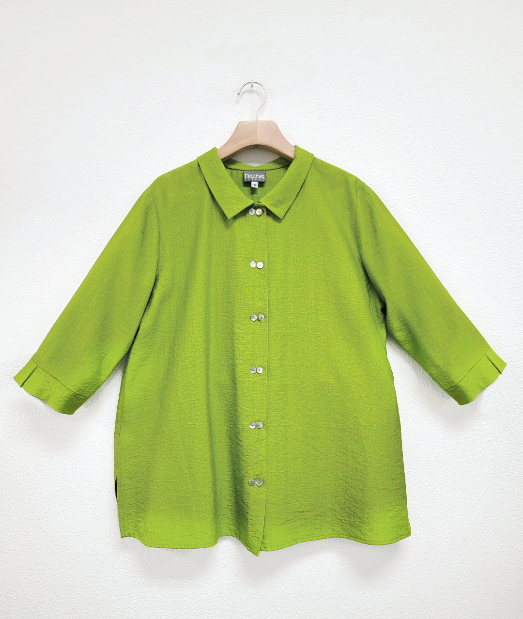 lime button down blouse with a twinbutton detail, 3/4 sleeves and a long body