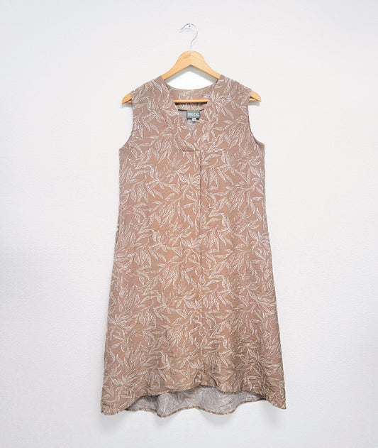 taupe sleeveless dress with a vneck and a white leaf print