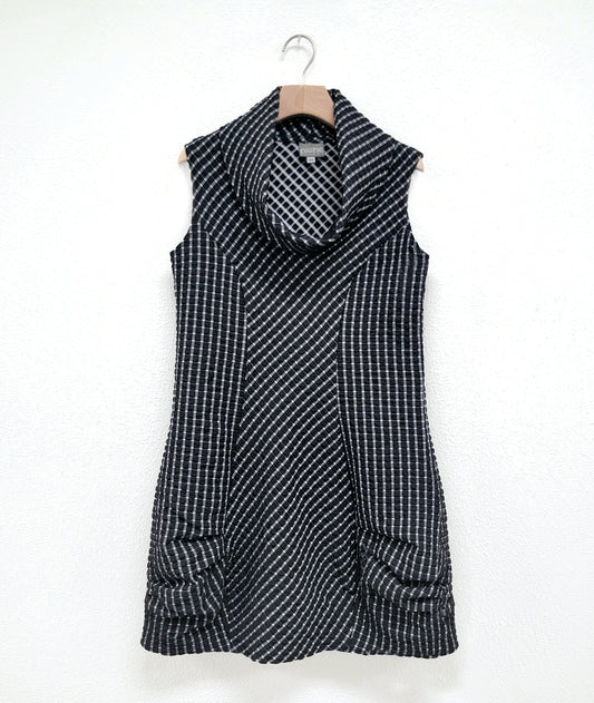 black and white grid print tunic with a cowl neck, princess seams, pockets and a pleating detail at the hips