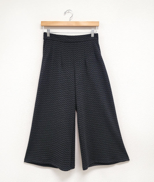 wide leg black and grey zipper print pant with pockets, waist darts and a flat front waistband