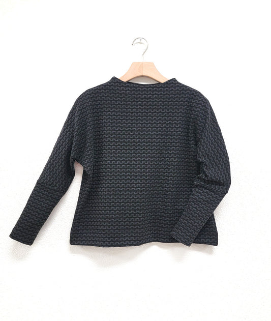 black and grey zipper knit pullover top with a high neckline and dolman sleeves. 