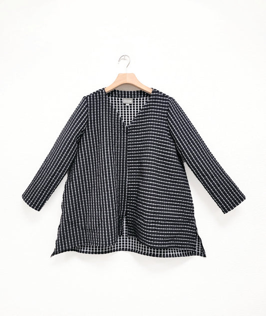 black and white check print pullover top with contrasting panels and a v-neck