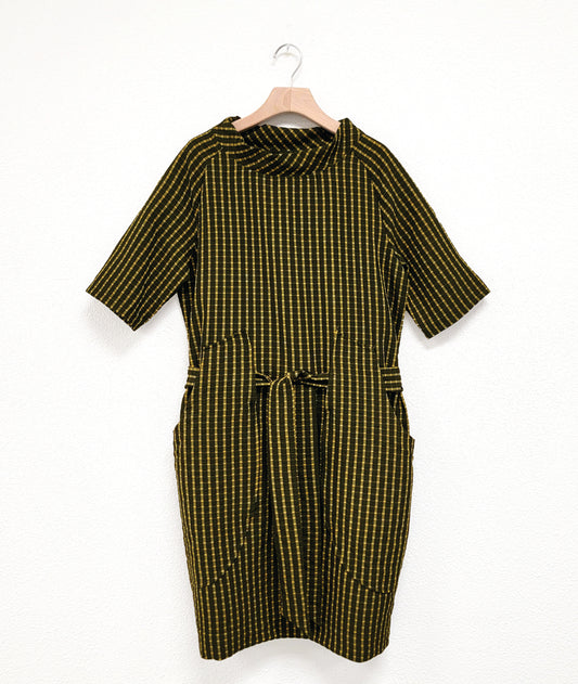 black and yellow mini plaid raglan sleeve shift dress with a matching tie belt at the waist, which runs through exterior pocket loops