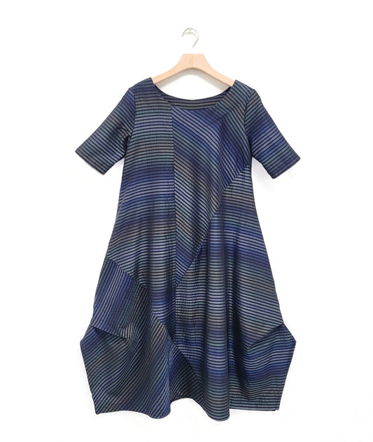 multi tone blue striped dress with contrasting panels and tucks on the sides