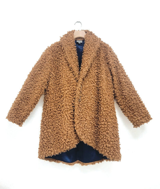 brown faux fur jacket with a kilt pin closure and a deep blue lining