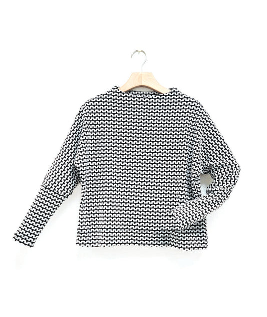 black and white zipper knit pullover top with a high neckline and dolman sleeves.