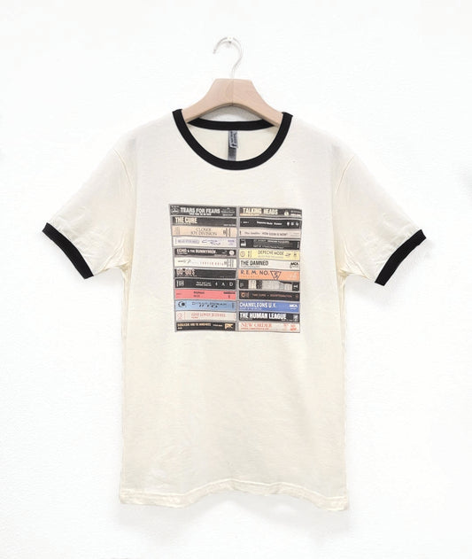 White t-shirt with black ringer sleeves and cassette tape design on a white background