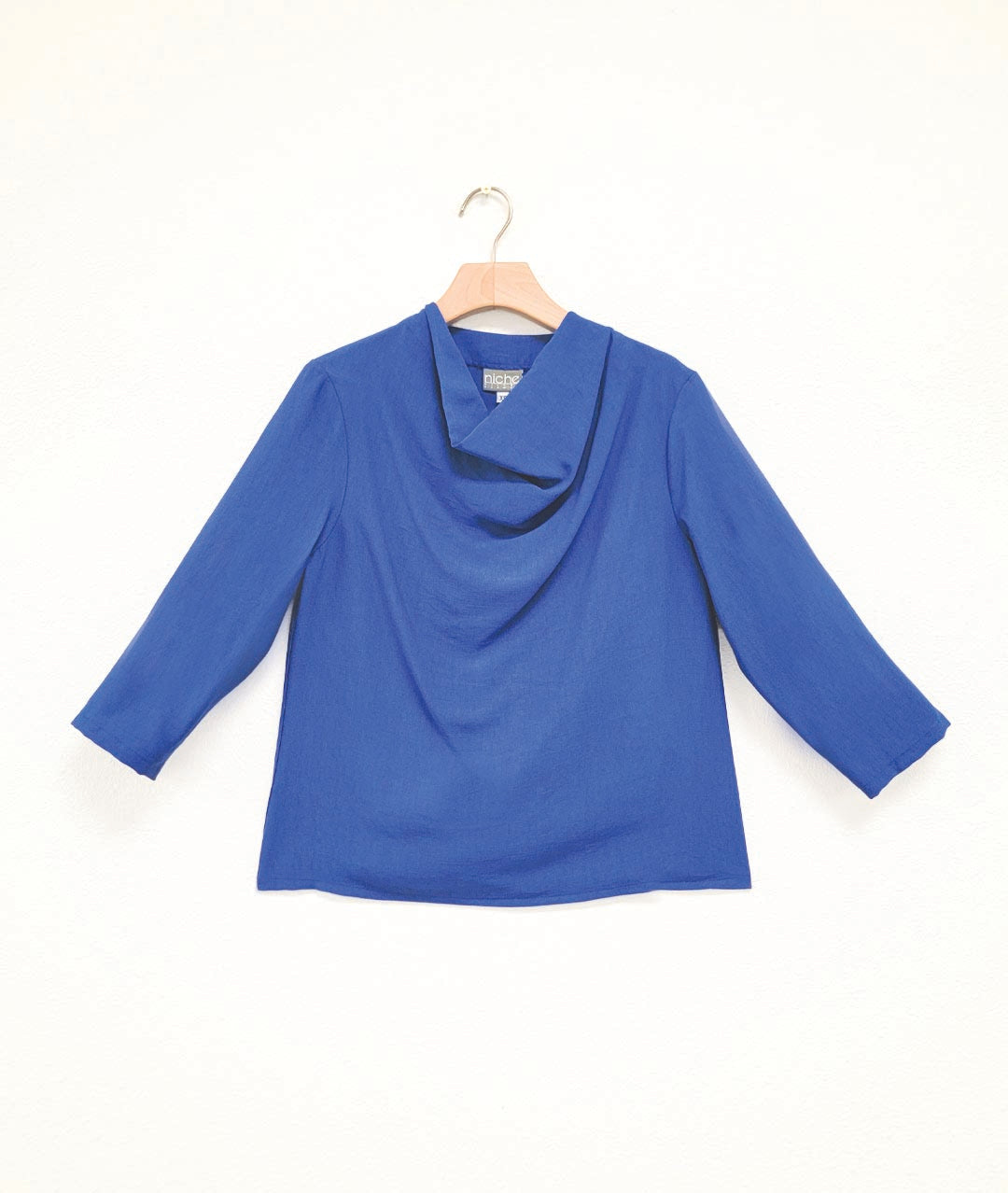 royal blue pullover top with 3/4 sleeves and a cowl neck