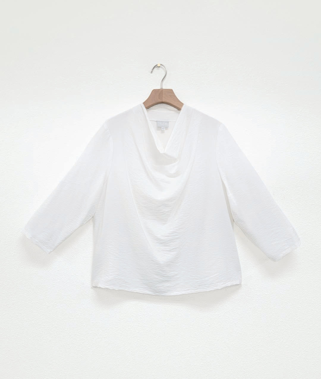white pullover top with 3/4 sleeves and a cowl neck
