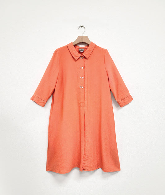 apricot orange twinbutton shirt dress on a hanger