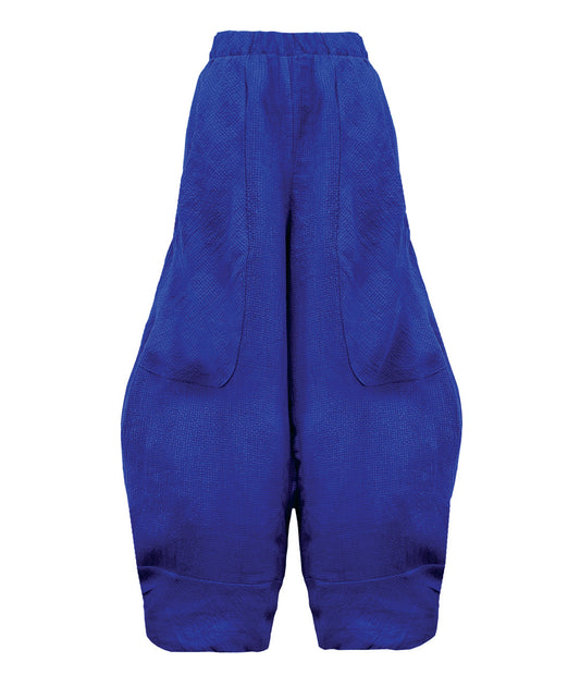 wide leg blue pant with a tapered ankle, oversized exterior pockets, and a tiny grid texture