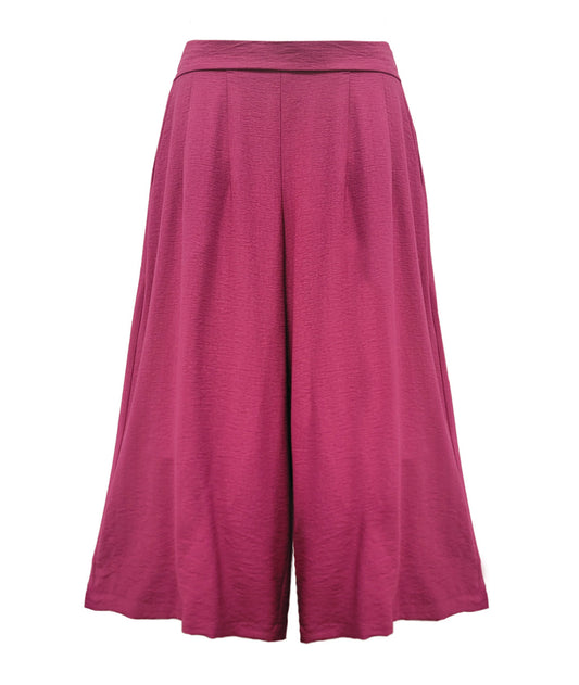 Pink wide leg pants on a white background