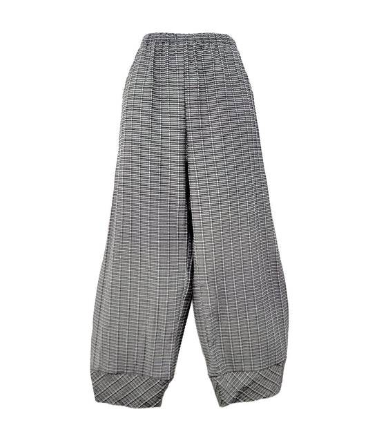 black, grey and white grid print pants with a barrel leg, tapered ankle and elastic waistband