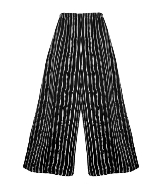 A pair of wide-leg trousers featuring a vertical wavy stripe pattern in black and white, displayed against a solid white background.