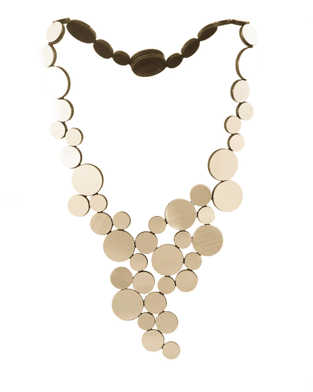 Gold circle cluster necklace against white background