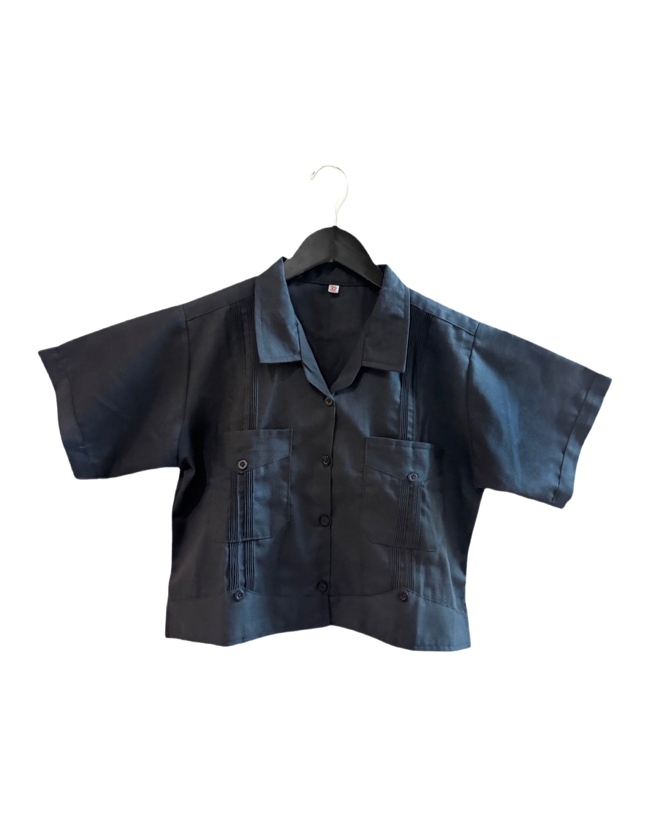 Black shirt on a hanger against a white background