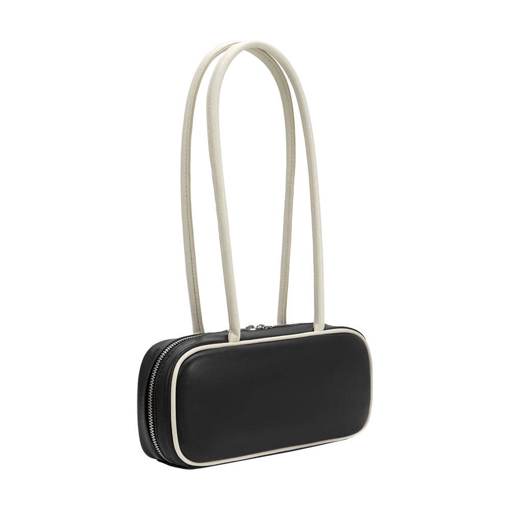 Black handbag with a white strap on a white background
