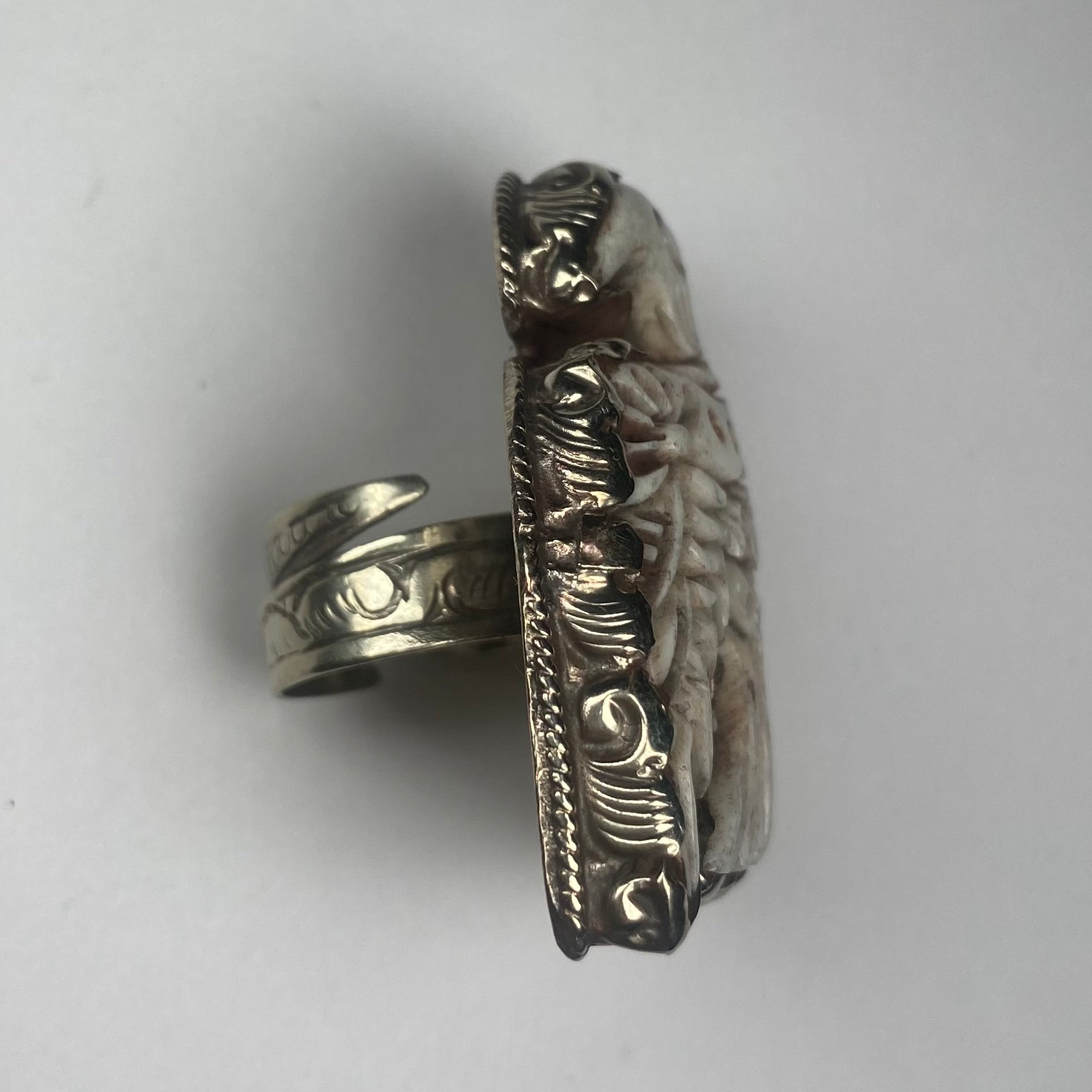 Side engraved thunderbird ring in cattle bone.