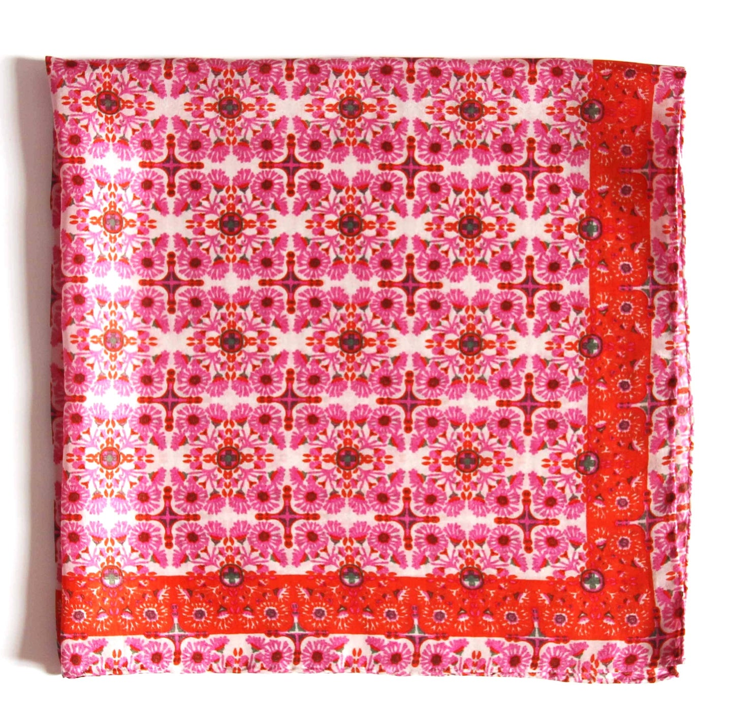 Red and pink patterned fabric square on a white background