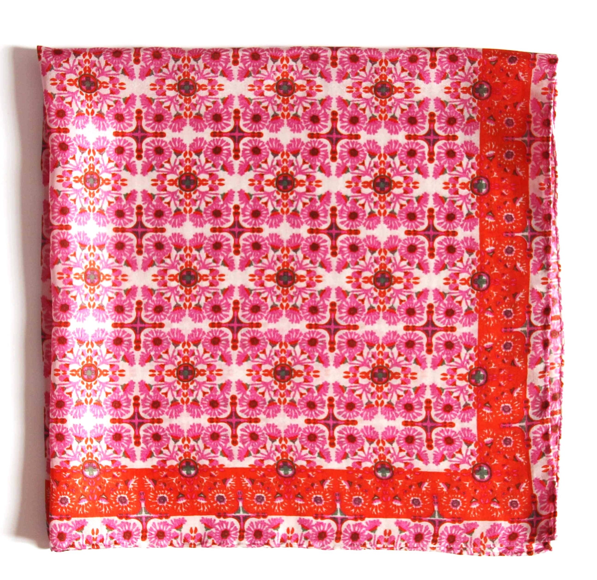 Red and pink patterned fabric square on a white background