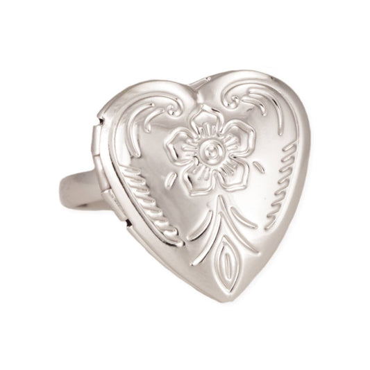 Silver heart-shaped locket ring with floral design on a white background