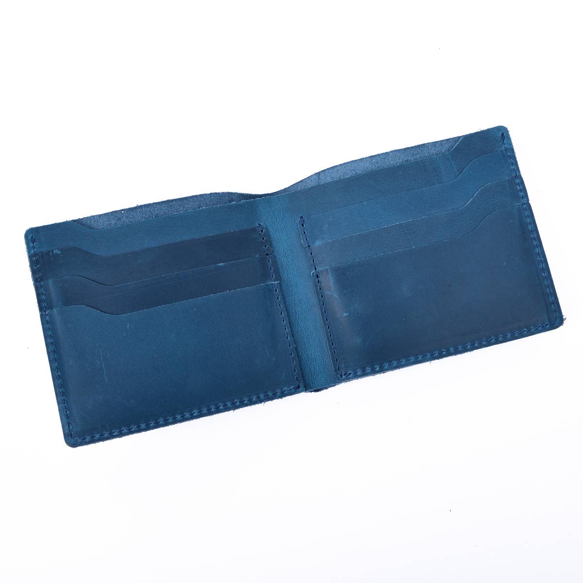 blue leather wallet opened against white background