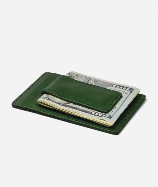 green wallet with magnetic money clip holding a few bills