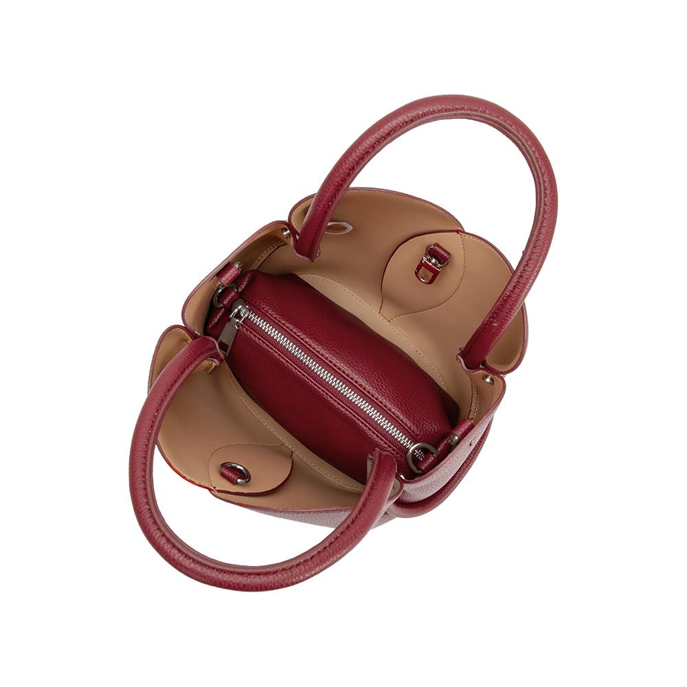 Two-tone handbag with red and beige colors on a white background