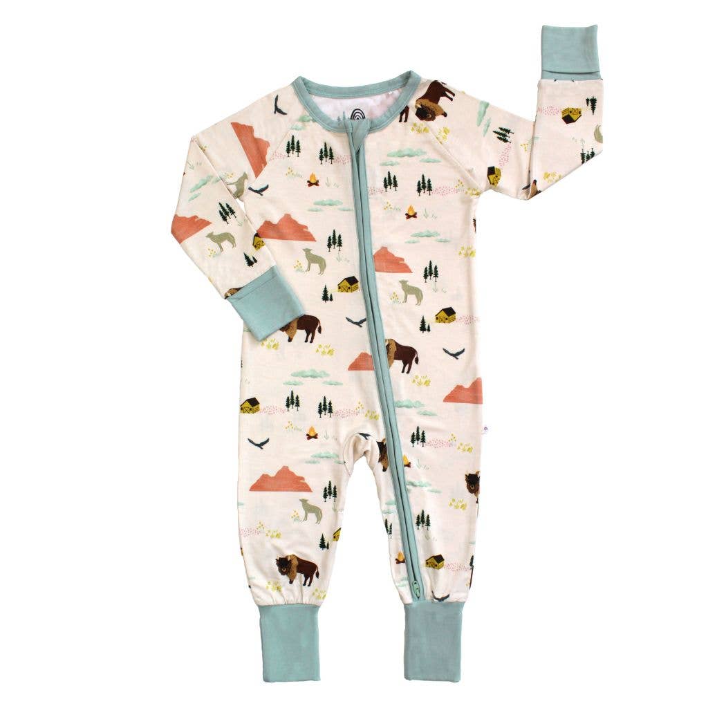 Children's onesie with nature-themed print on a white background