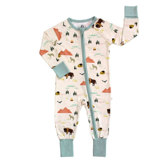 Children's onesie with nature-themed print on a white background