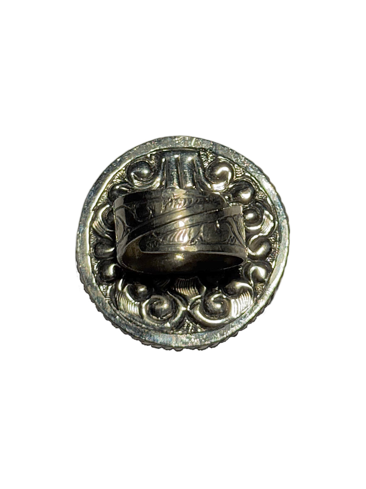 Back of silver ring showing adjustable feature and carving detailing on a white background
