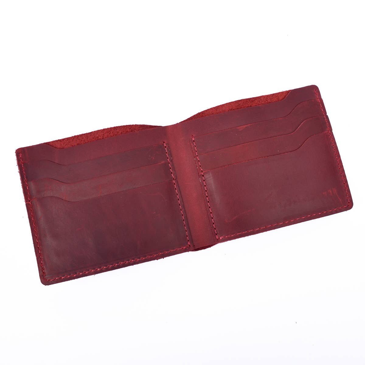 red leather wallet opened against white background