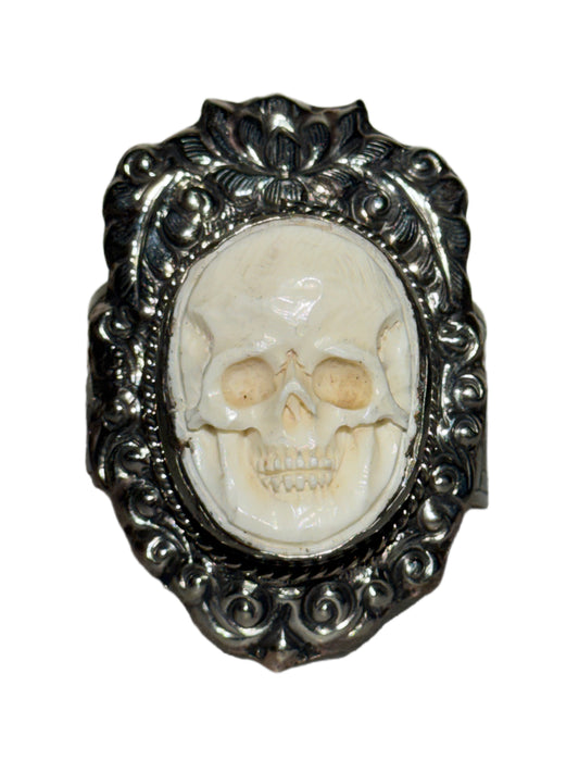 Skull ring in a silver frame on a white background