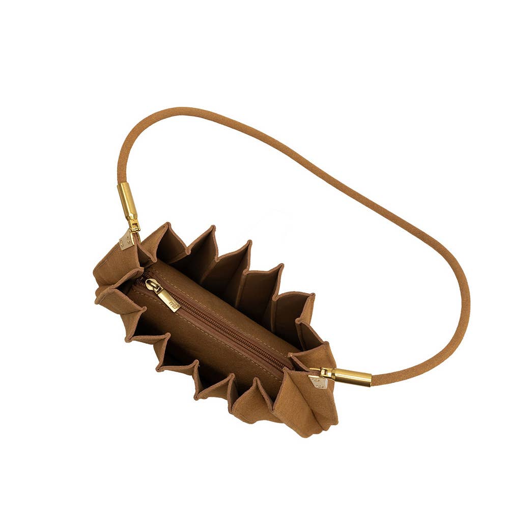 A brown leather shoulder bag with a unique pleated, accordion-like exterior and a thin matching leather strap, shown on a plain white background.