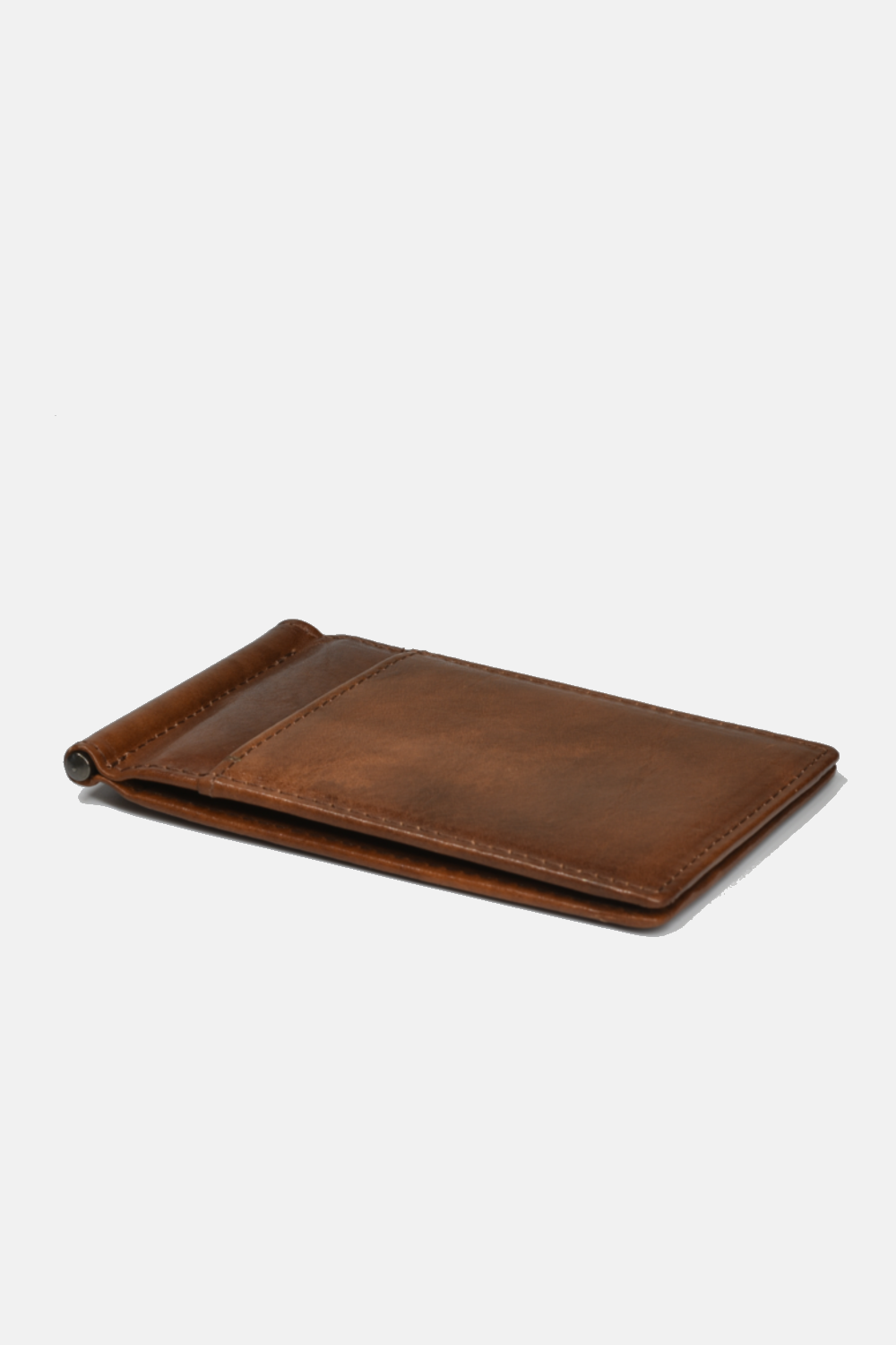 brown wallet laying flat against a white background
