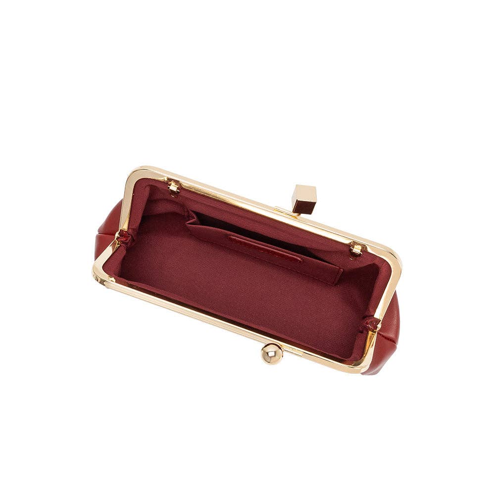 A burgundy satin clutch purse with a gold-tone metal kiss-lock frame, shown open against a solid white background.