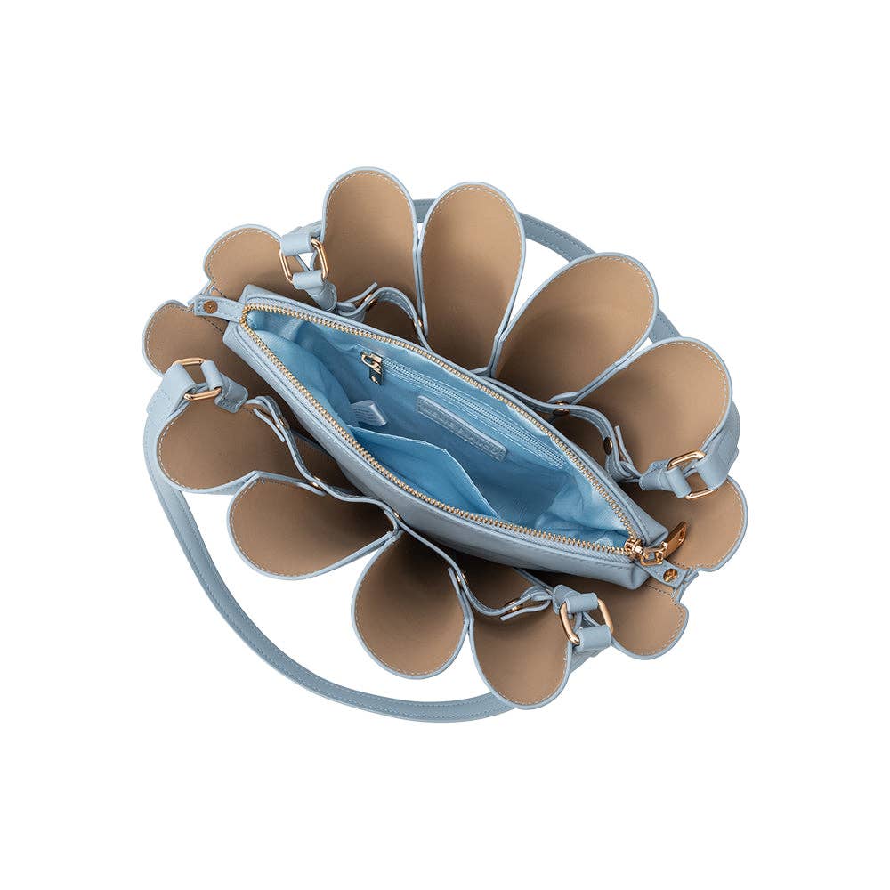 Light blue handbag with beige flower-like design on a white background