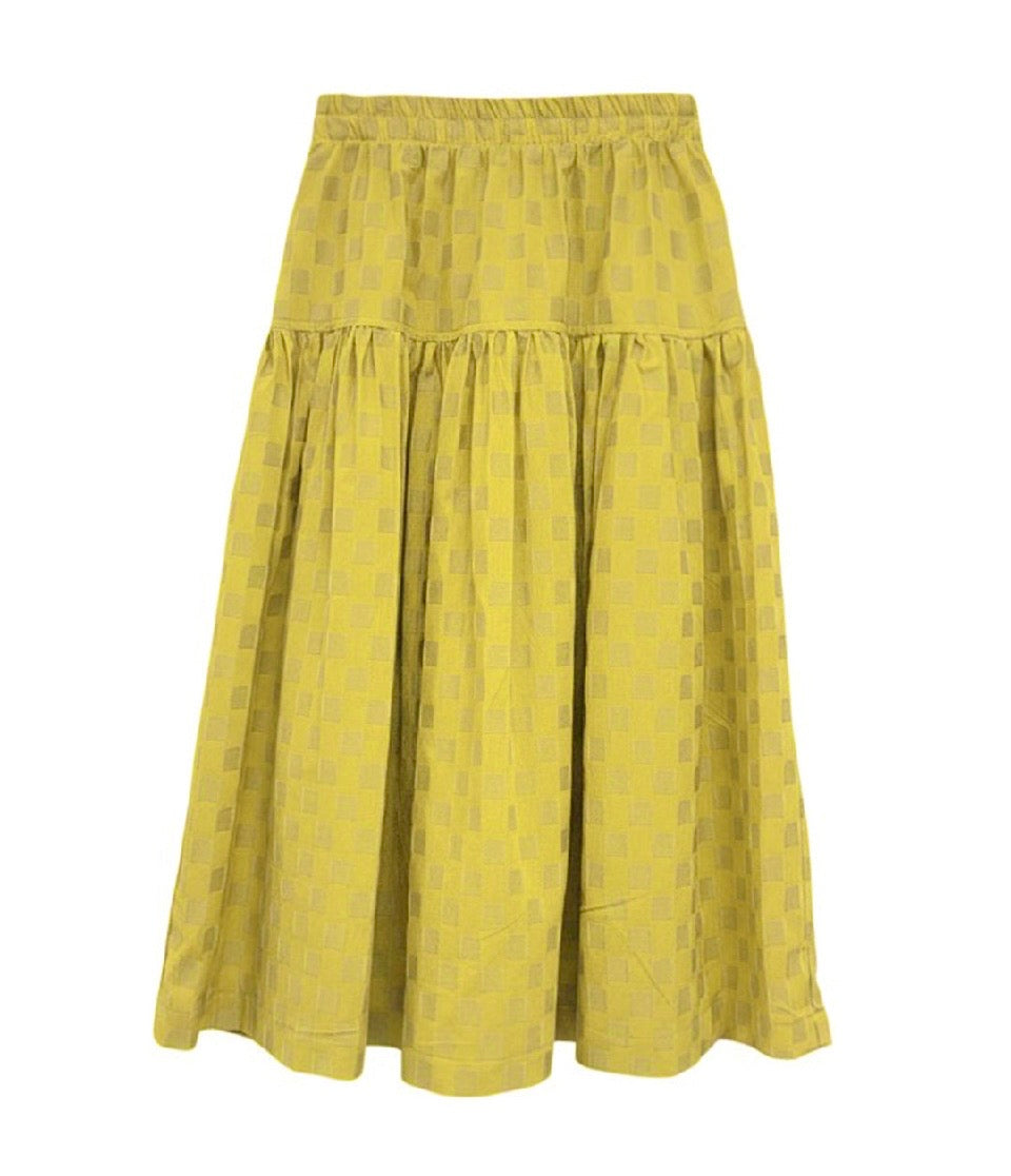 Yellow skirt with a subtle pattern on a white background