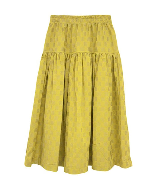 Yellow skirt with a subtle pattern on a white background