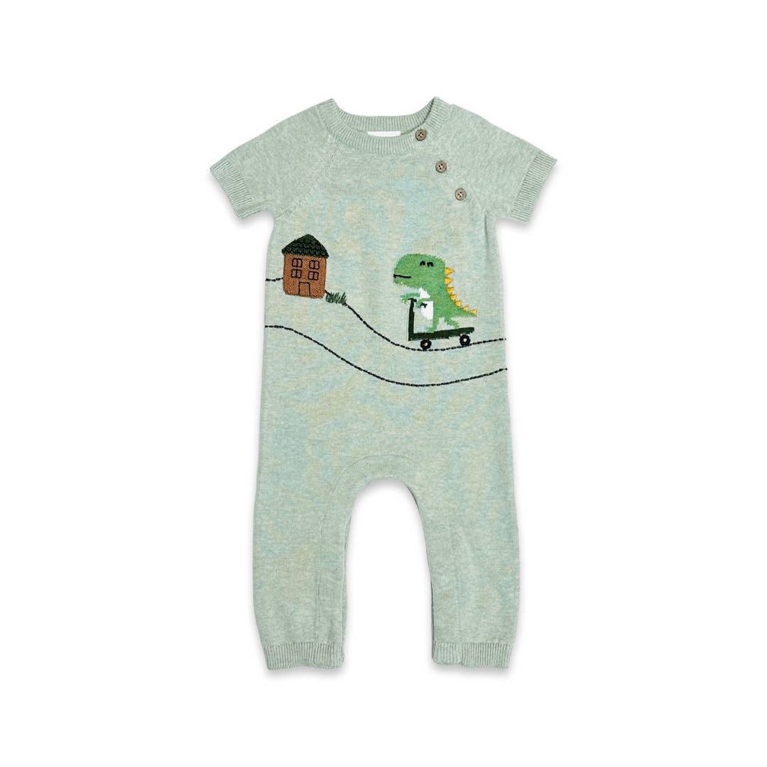 green knit baby jumpsuit featuring dinosaur on a scooter and a house