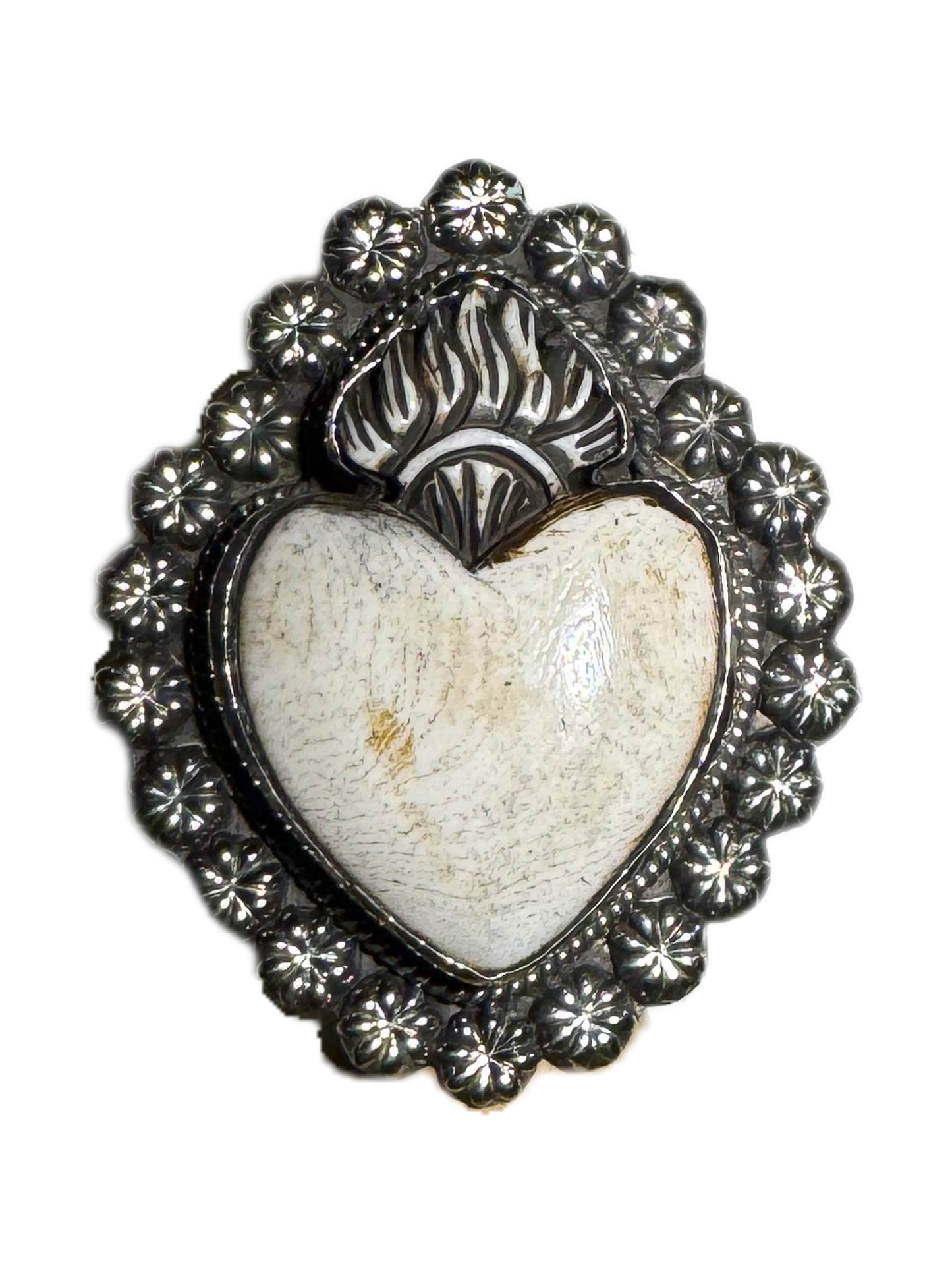 Heart-shaped stone with silver decorative frame on a white background