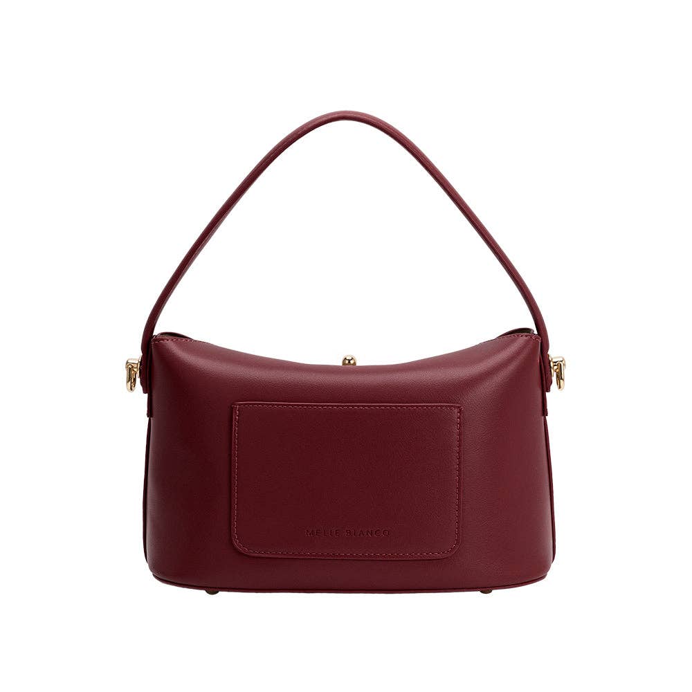 Maroon handbag with gold accents on a white background