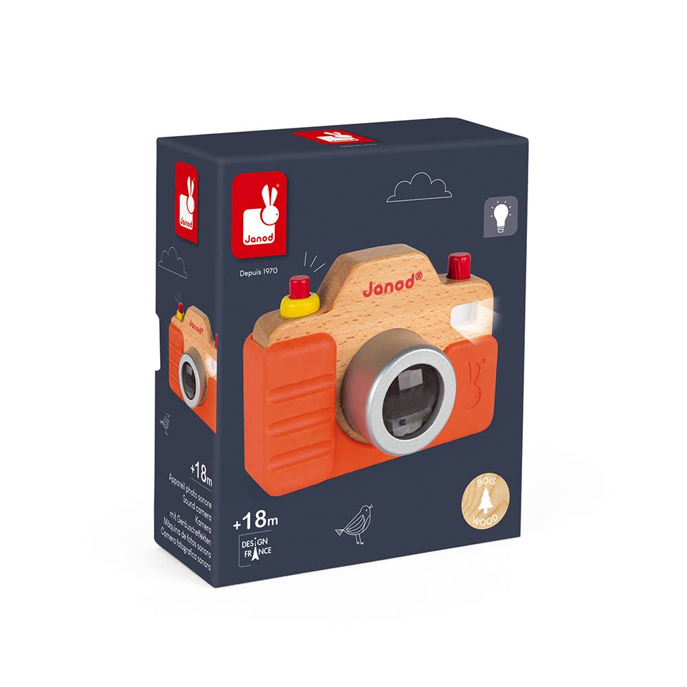 Box of a wooden toy camera with Janod branding on a white background